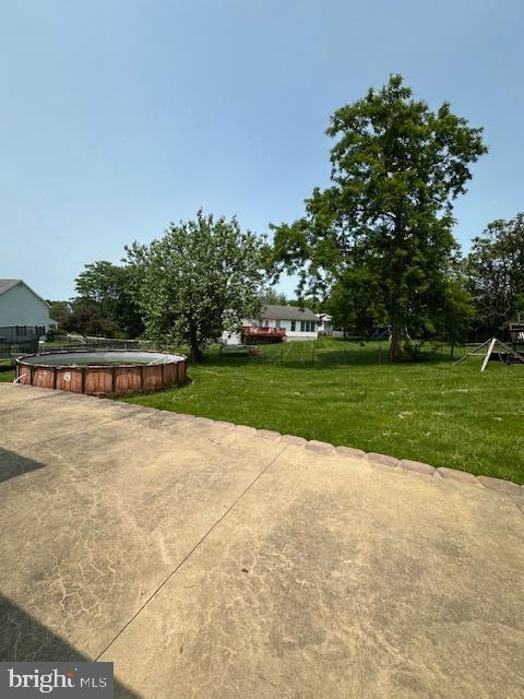 121 Defense Ct, Hedgesville, WV 25427 - view of grassy yard with a patio area and an outdoor pool