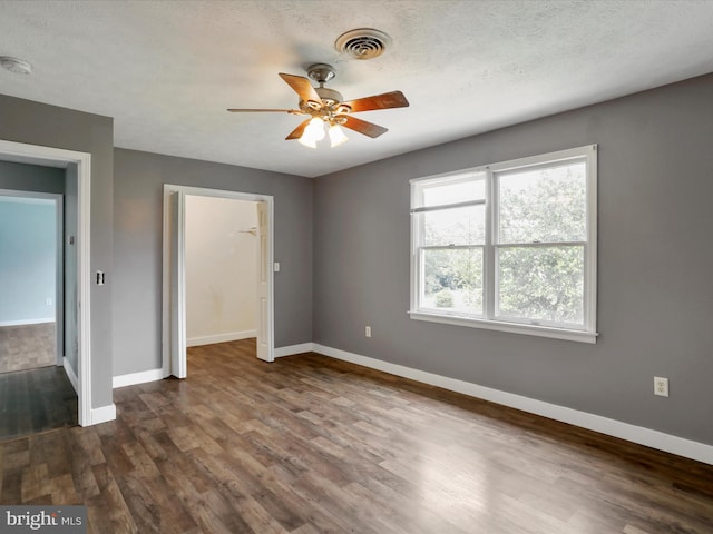 121 Defense Ct, Hedgesville, WV 25427 - unfurnished bedroom with baseboards, dark wood-style flooring, and a closet