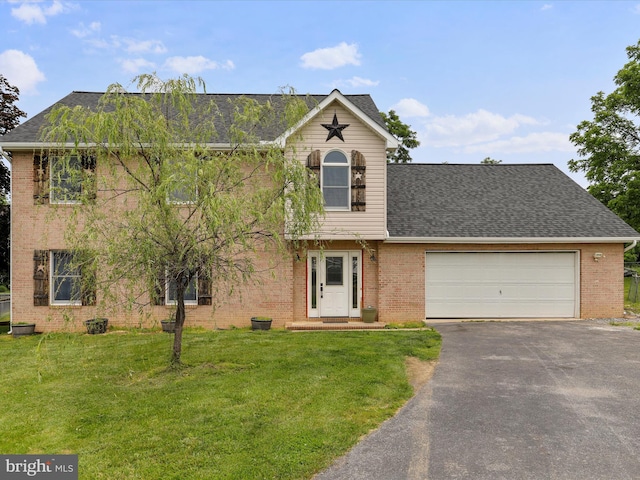 121 Defense Ct, Hedgesville, WV 25427 - view of front of house with brick siding, driveway, and a front yard