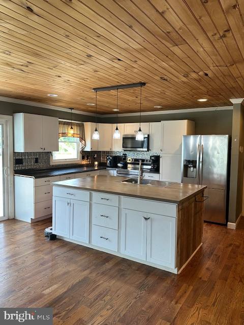 121 Defense Ct, Hedgesville, WV 25427 - kitchen featuring stainless steel appliances, wood ceiling, a center island with sink, white cabinets, and ornamental molding