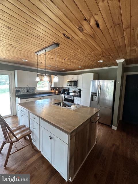 121 Defense Ct, Hedgesville, WV 25427 - kitchen featuring stainless steel appliances, wooden ceiling, a sink, ornamental molding, and white cabinets