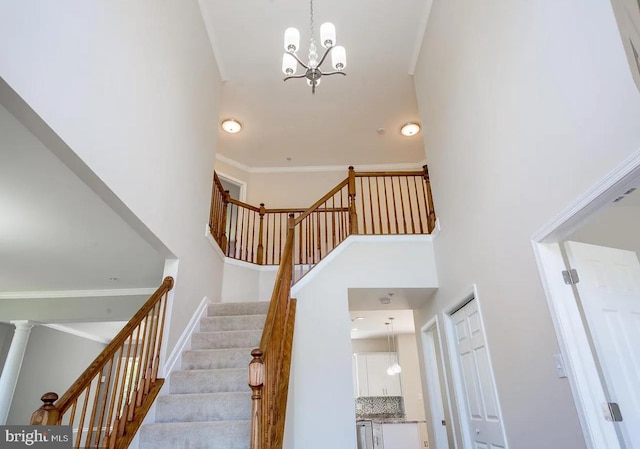 6215 Erland Way, Lanham, MD 20706 - stairs with a towering ceiling, a chandelier, ornamental molding, and baseboards
