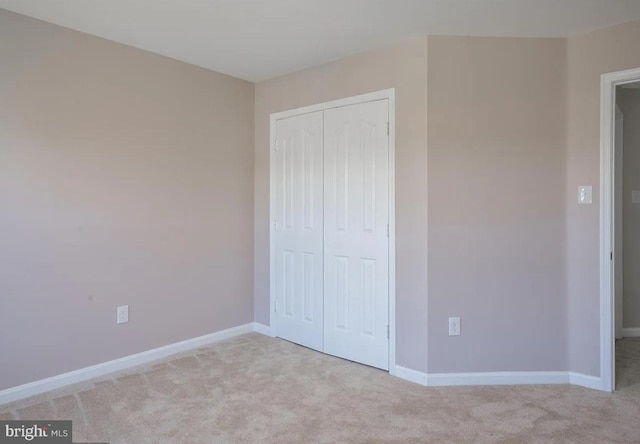6215 Erland Way, Lanham, MD 20706 - unfurnished bedroom with light carpet, a closet, and baseboards