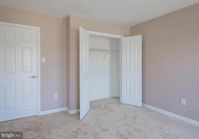 6215 Erland Way, Lanham, MD 20706 - unfurnished bedroom featuring carpet, a closet, and baseboards