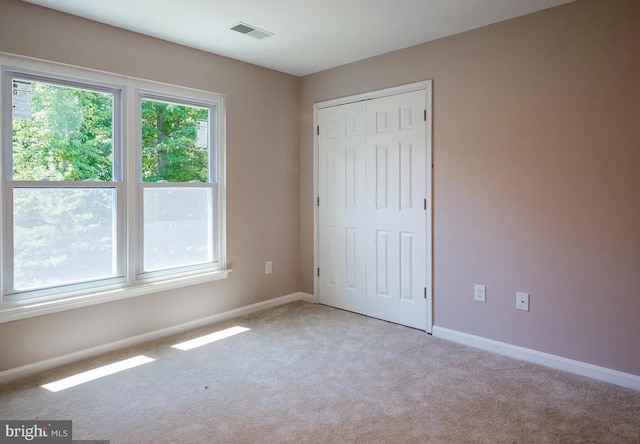 6215 Erland Way, Lanham, MD 20706 - unfurnished bedroom featuring carpet floors, baseboards, and a closet
