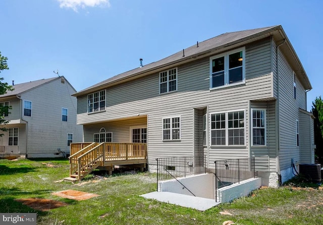 6215 Erland Way, Lanham, MD 20706 - back of house with a deck, a lawn, and central air condition unit