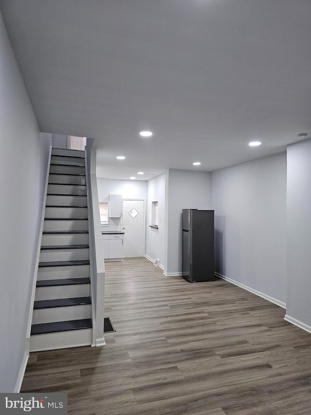 2249 Kennedy St, Philadelphia, PA 19137 - stairway with wood finished floors, recessed lighting, and baseboards