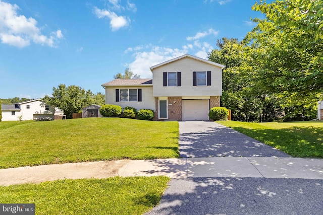 8892 Mckinley Ct, Hummelstown, PA 17036 - split level home with driveway, brick siding, an attached garage, and a front yard