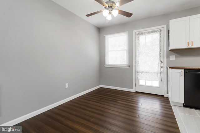8892 Mckinley Ct, Hummelstown, PA 17036 - unfurnished dining area featuring healthy amount of natural light, a ceiling fan, dark wood-style flooring, and baseboards