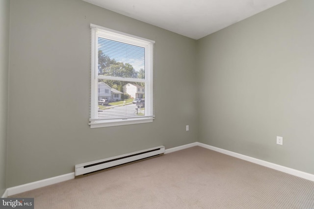 8892 Mckinley Ct, Hummelstown, PA 17036 - spare room featuring a baseboard heating unit, carpet, and baseboards