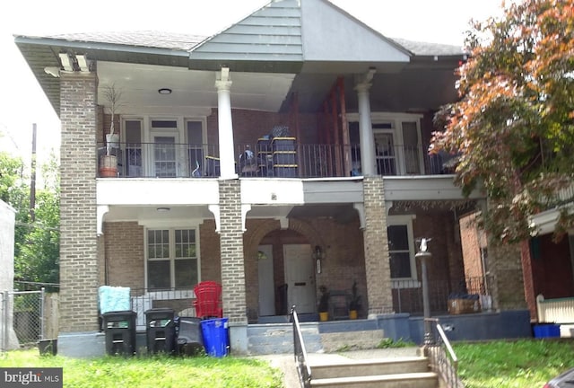5400 Angora Ter, Philadelphia, PA 19143 - view of front facade featuring brick siding and covered porch
