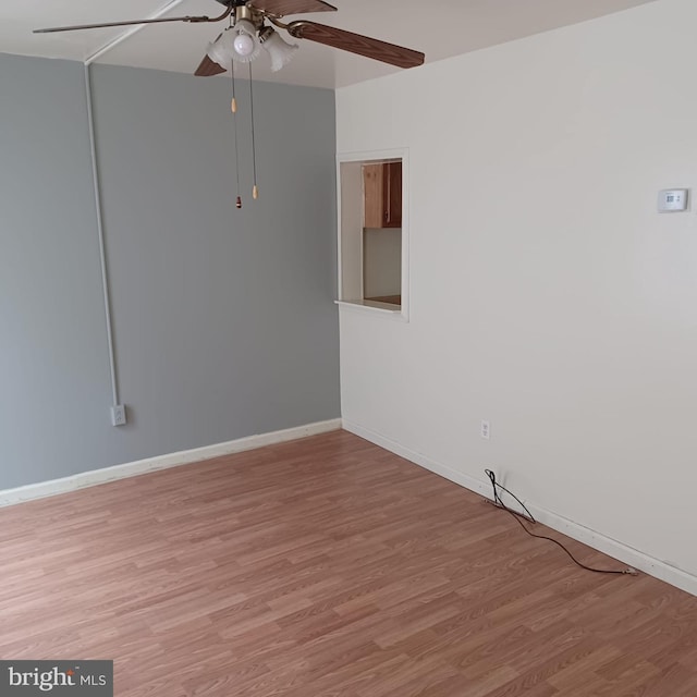 617 Oak St, Allentown, PA 18102 - empty room with light wood-style floors, ceiling fan, and baseboards