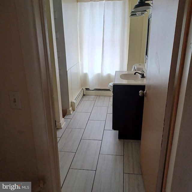 617 Oak St, Allentown, PA 18102 - bathroom with vanity, a baseboard heating unit, and toilet