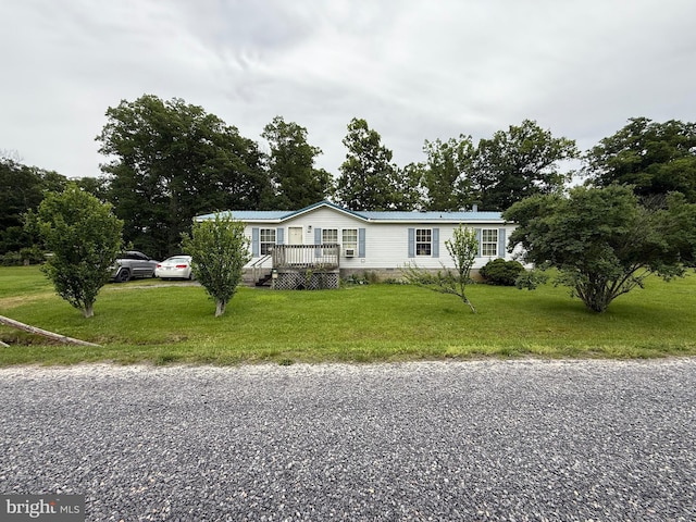 205 Jacob Dr, Moorefield, WV 26836 - manufactured / mobile home with a wooden deck, a front yard, and gravel driveway