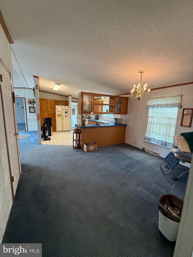 205 Jacob Dr, Moorefield, WV 26836 - living room with a textured ceiling, carpet floors, and a chandelier
