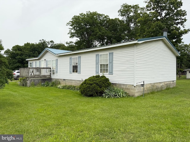 205 Jacob Dr, Moorefield, WV 26836 - view of property exterior featuring crawl space, a deck, a lawn, and metal roof