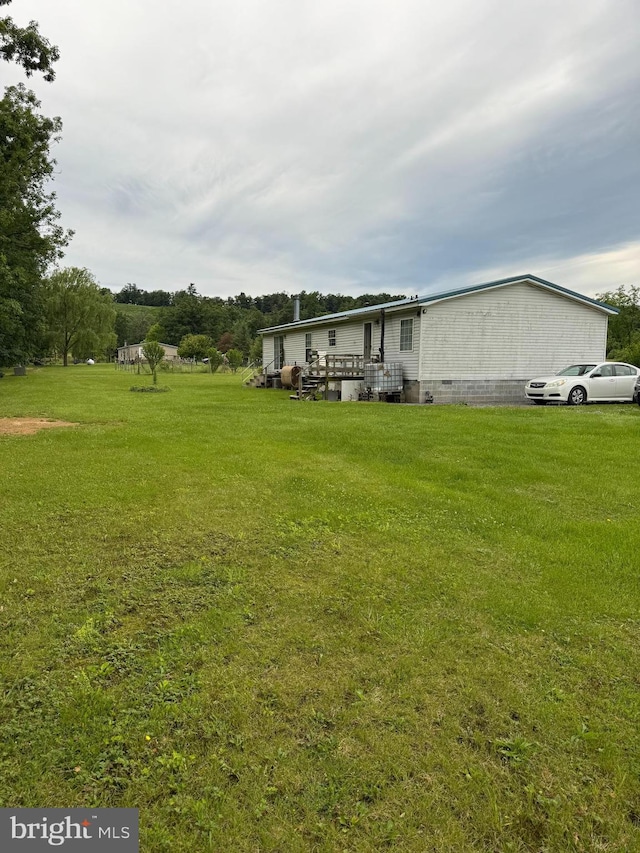 205 Jacob Dr, Moorefield, WV 26836 - rear view of property featuring a lawn, a wooden deck, and crawl space