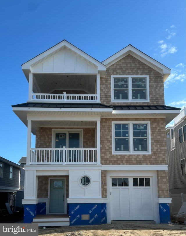 11 E 13th, Long Beach Township, NJ 08008 - view of front of property with a balcony and an attached garage