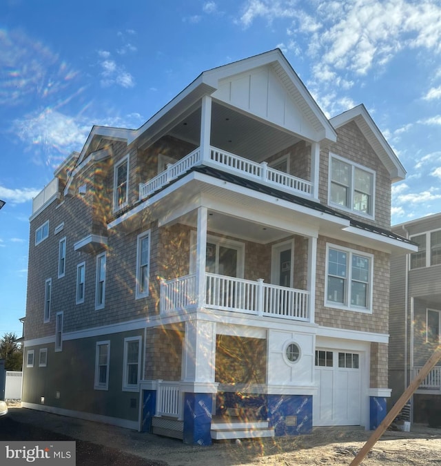11 E 13th, Long Beach Township, NJ 08008 - view of front of property with a balcony and a garage