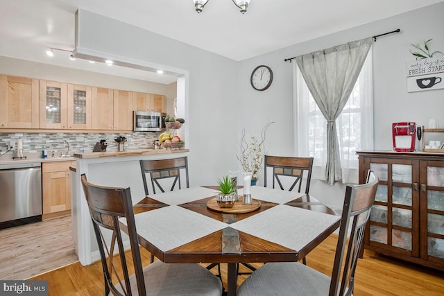 7215 Conley St, Baltimore, MD 21224 - dining room featuring light wood-style floors