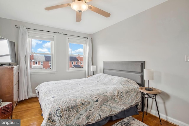 7215 Conley St, Baltimore, MD 21224 - bedroom featuring light wood-type flooring, baseboards, and a ceiling fan