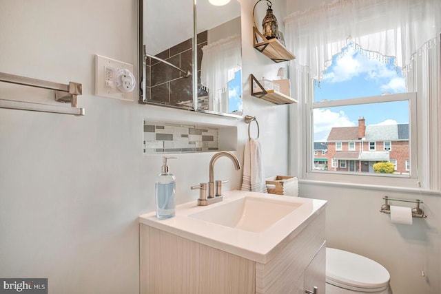 7215 Conley St, Baltimore, MD 21224 - bathroom with vanity, toilet, and a shower