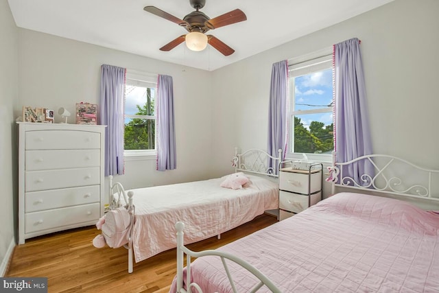 7215 Conley St, Baltimore, MD 21224 - bedroom with wood finished floors, multiple windows, and ceiling fan