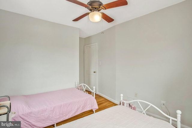 7215 Conley St, Baltimore, MD 21224 - bedroom featuring light wood-style flooring, baseboards, and ceiling fan
