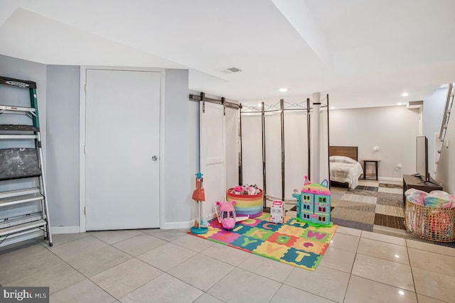 7215 Conley St, Baltimore, MD 21224 - game room featuring light tile patterned floors, a barn door, baseboards, and recessed lighting