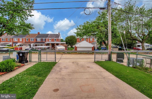 7215 Conley St, Baltimore, MD 21224 - exterior space featuring a gate, a garage, and a residential view