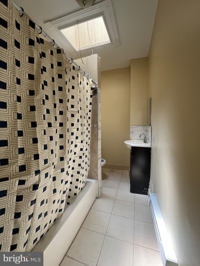 27 N 51st St, Philadelphia, PA 19139 - bathroom featuring toilet, vanity, shower / bath combo with shower curtain, tile patterned flooring, and baseboards