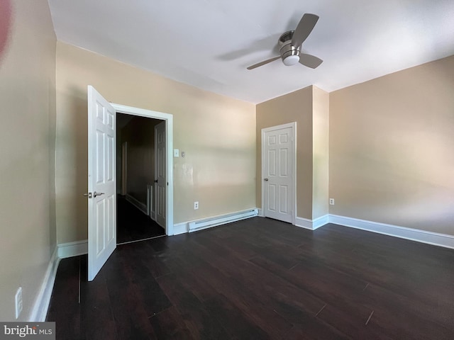27 N 51st St, Philadelphia, PA 19139 - spare room with a baseboard heating unit, a ceiling fan, dark wood finished floors, and baseboards