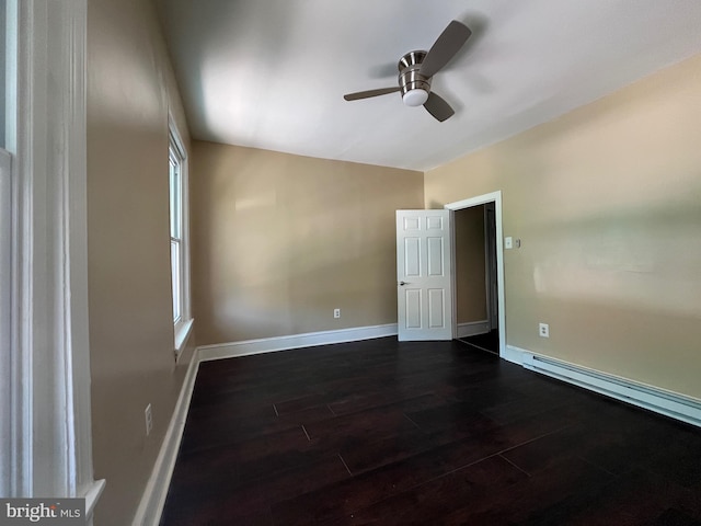 27 N 51st St, Philadelphia, PA 19139 - unfurnished room with dark wood-style flooring, a ceiling fan, baseboards, and a baseboard radiator
