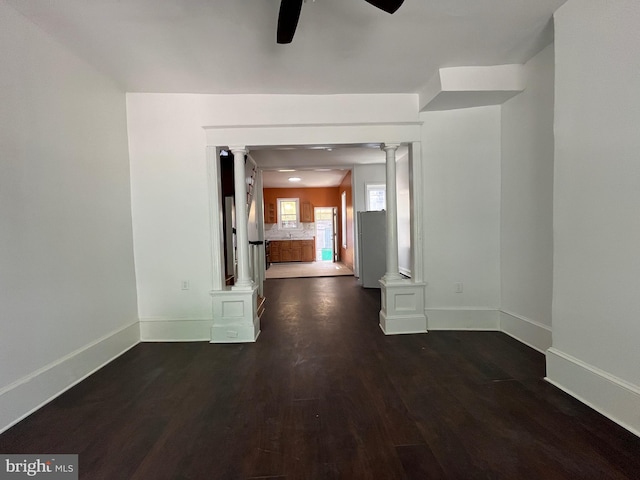 27 N 51st St, Philadelphia, PA 19139 - empty room featuring ornate columns, ceiling fan, wood finished floors, and baseboards