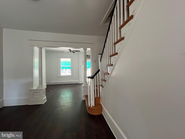 27 N 51st St, Philadelphia, PA 19139 - hall with decorative columns, a baseboard radiator, stairway, baseboards, and dark wood-type flooring