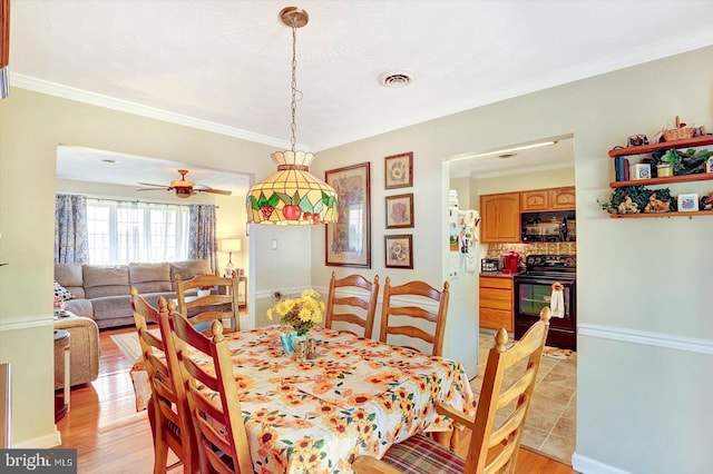 3476 Messersmith Rd, York, PA 17408 - dining area featuring ornamental molding, light wood-style floors, and a ceiling fan