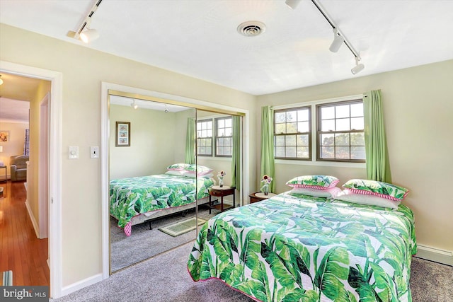 3476 Messersmith Rd, York, PA 17408 - bedroom featuring track lighting, baseboards, a baseboard heating unit, and a closet