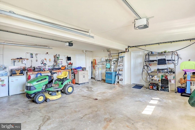3476 Messersmith Rd, York, PA 17408 - garage with a garage door opener, gas water heater, and a workshop area