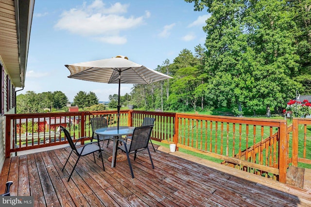 3476 Messersmith Rd, York, PA 17408 - deck with outdoor dining space, a yard, and view of wooded area
