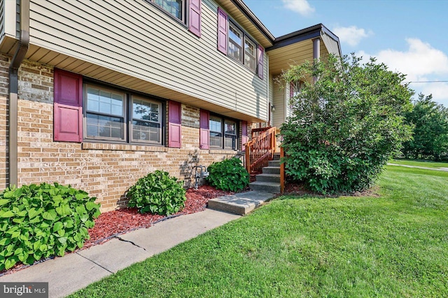 3476 Messersmith Rd, York, PA 17408 - doorway to property featuring a lawn and brick siding