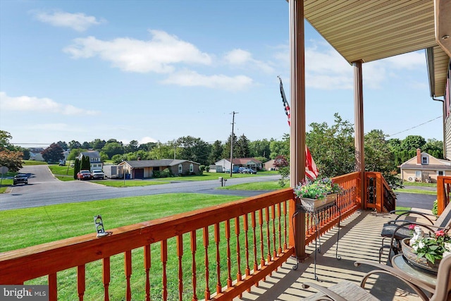 3476 Messersmith Rd, York, PA 17408 - wooden porch featuring a lawn and a residential view