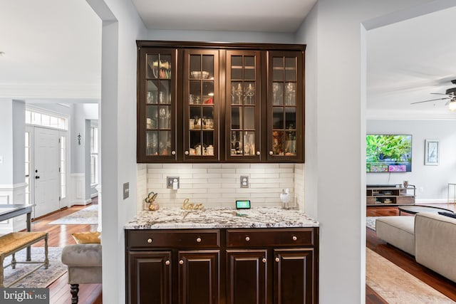 4300 Mountain Laurel Way, Brandywine, MD 20613 - bar area featuring wood finished floors, a ceiling fan, tasteful backsplash, crown molding, and wainscoting