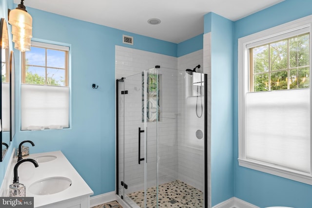 4300 Mountain Laurel Way, Brandywine, MD 20613 - bathroom with a shower stall, baseboards, and double vanity