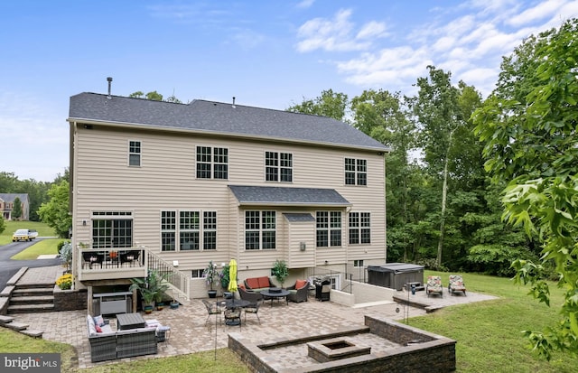 4300 Mountain Laurel Way, Brandywine, MD 20613 - back of house featuring a hot tub, a patio area, an outdoor hangout area, and a lawn