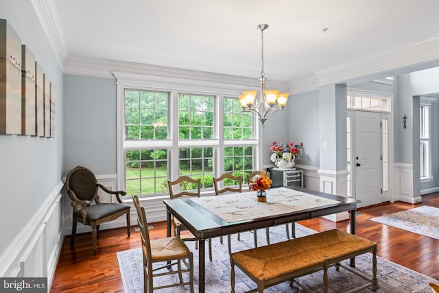 4300 Mountain Laurel Way, Brandywine, MD 20613 - dining area with a decorative wall, a chandelier, healthy amount of natural light, a wainscoted wall, and ornamental molding