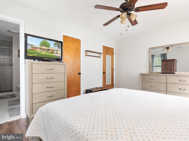 29 8th St, Colonial Beach, VA 22443 - bedroom featuring dark wood-style flooring, ensuite bath, and ceiling fan