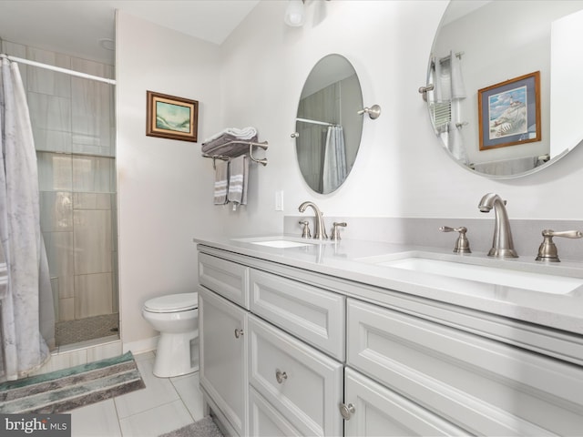 29 8th St, Colonial Beach, VA 22443 - bathroom with double vanity, tiled shower, and tile patterned flooring