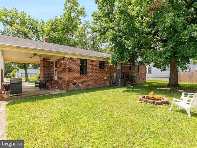 29 8th St, Colonial Beach, VA 22443 - view of green lawn featuring an outdoor fire pit, a patio area, and ceiling fan