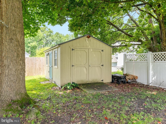 29 8th St, Colonial Beach, VA 22443 - view of shed with a fenced backyard