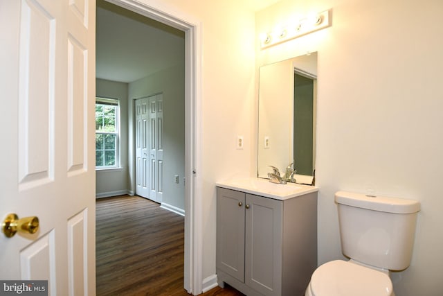 1031 Gardenview Loop Unit 103, Woodbridge, VA 22191 - half bathroom featuring vanity and wood finished floors